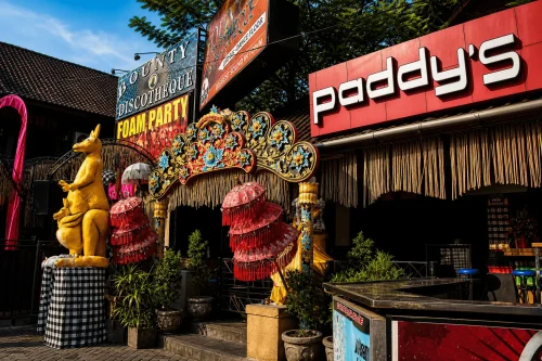 Paddy’s Pub entrance with colorful Balinese decor and nightlife signs in Kuta Bali.