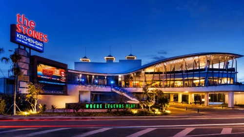Modern nightlife venue and entertainment center in Kuta Bali with vibrant lights, contemporary architecture, and lively evening atmosphere.