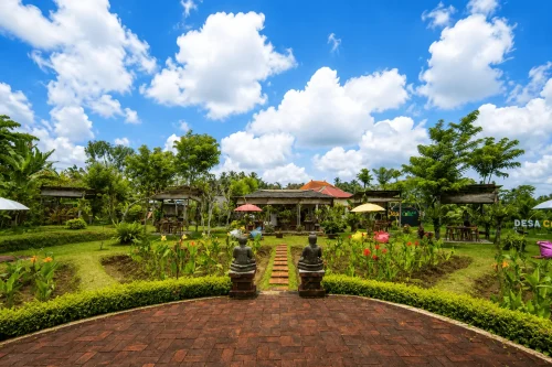 A beautiful park area at Bali Chocolate Village featuring lush green gardens, tropical landscaping, relaxing walking paths, and a peaceful family-friendly atmosphere surrounded by nature.