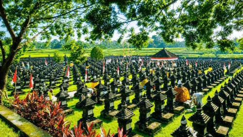 A serene view of Margarana Memorial Park featuring the Bajra Sandhi monument surrounded by lush greenery, honoring Bali’s independence heroes and commemorating the historic Puputan Margarana battle.