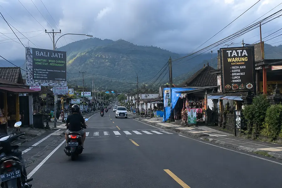 A road through Kintamani village with a mountain view, perfect for adventurous self-drive trips in Bali | balitouristic.com