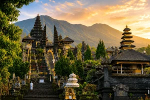 A majestic view of Besakih Temple surrounded by misty mountains and lush tropical scenery, showcasing one of the hidden temples in Bali with traditional Balinese architecture and a sacred spiritual atmosphere.
