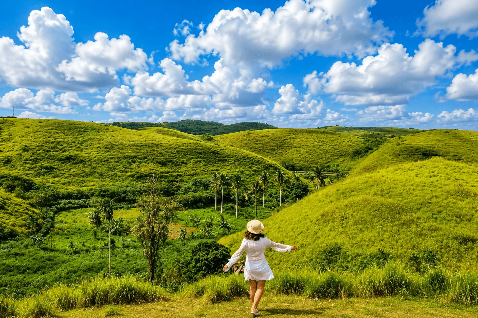 A breathtaking landscape view of Teletubbies Hill featuring rolling green hills, scenic valleys, blue skies, and peaceful tropical countryside scenery.