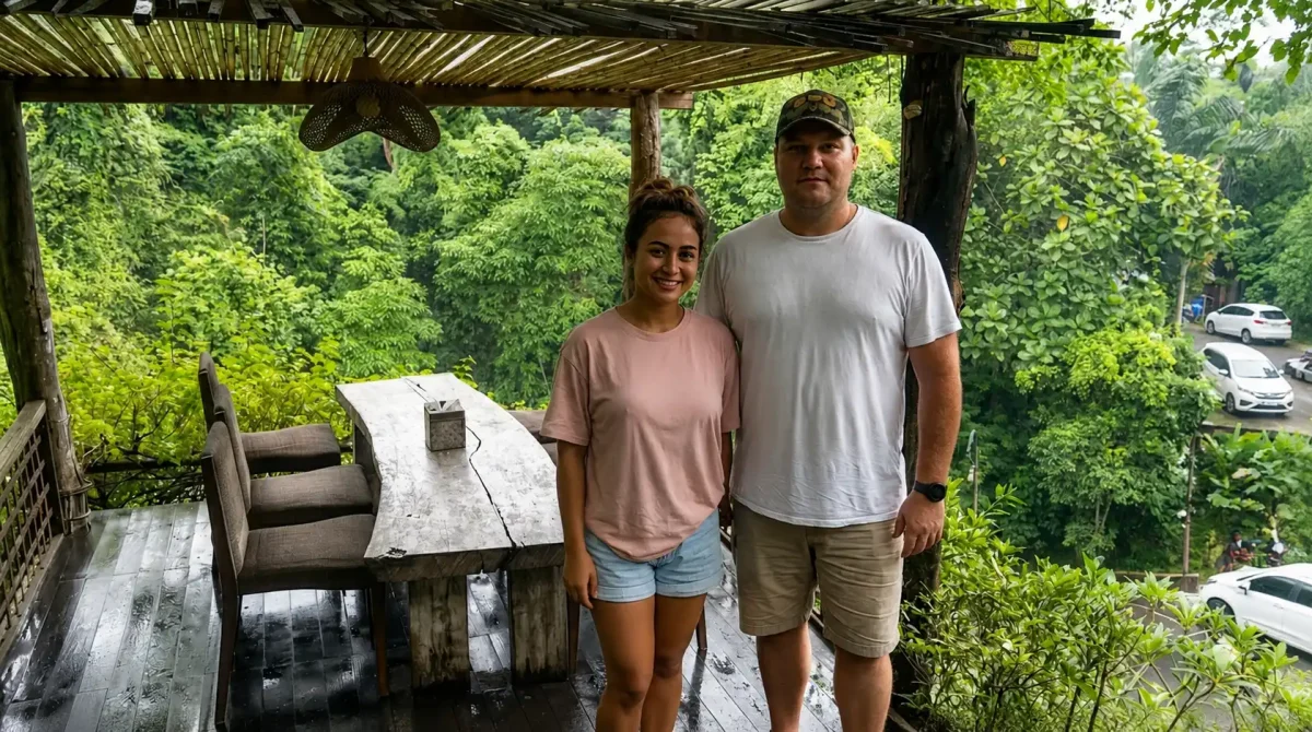 A happy tourist couple enjoying a comfortable airport transfer from Ngurah Rai International Airport to Ubud, traveling in a modern vehicle through Bali’s scenic tropical landscapes.