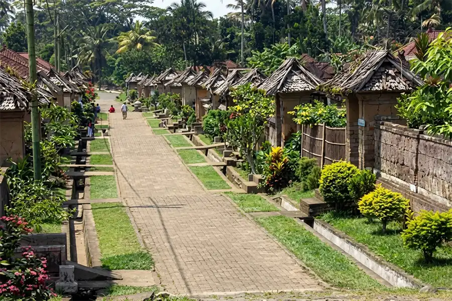 An empty local street during the Day of Silence, illustrating the pause of regular bali transportation during nyepi as traditional community guards (Pecalang) patrol the area. | balitouristic.com