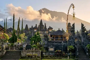 An archival vintage painting depicting traditional community life and local figures, showcasing a glimpse into the rich history of bali. | balitouristic.com