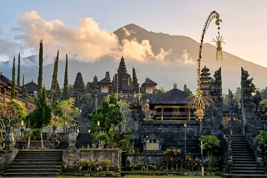 An archival vintage painting depicting traditional community life and local figures, showcasing a glimpse into the rich history of bali. | balitouristic.com