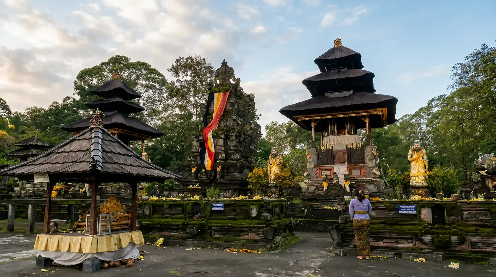A peaceful view of Jati Batur Temple featuring traditional Balinese temple architecture, serene mountain surroundings, lush greenery, and a sacred spiritual atmosphere in Bali’s highlands.