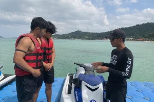 Tourists listening to a professional safety briefing from an instructor before riding a jet ski seminyak. | balitouristic.com