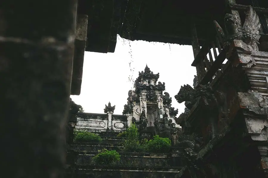 A close-up view of the detailed stone carvings and traditional Balinese architecture at the entrance where visitors present their lempuyang temple tickets. | balitouristic.com