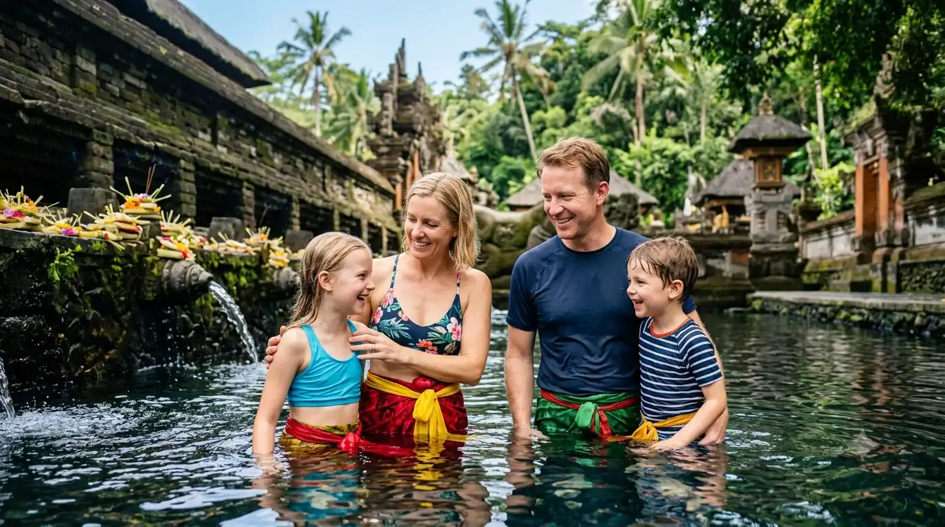 A happy family enjoying a guided Bali tours packages at Tirta Empul Temple, exploring the sacred temple grounds, traditional Balinese architecture, and tranquil water courtyards with a friendly local guide, surrounded by lush tropical scenery and a rich cultural atmosphere.