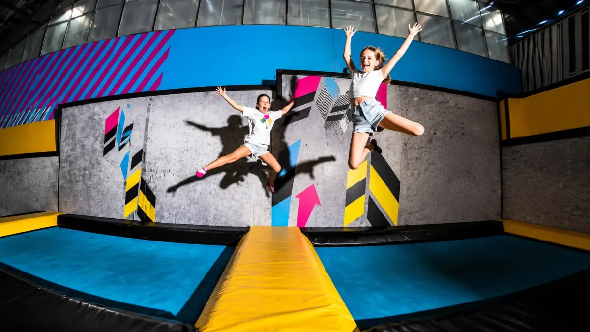 Children jumping on trampolines at Bounce Bali indoor trampoline park.