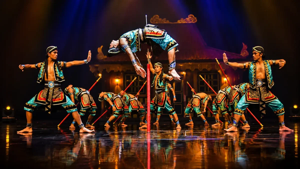 Acrobatic performers showcasing spectacular aerial stunts at the Devdan Show in Nusa Dua Theatre.