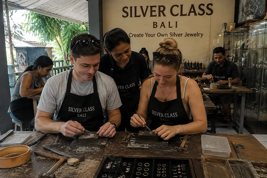 A traveler carefully crafting a unique sterling silver ring at an interactive art workshop bali. | balitouristic.com