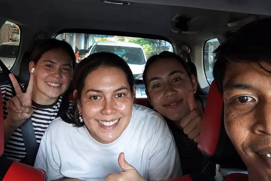 Tourists traveling with a private driver for a customized Bali day tour.