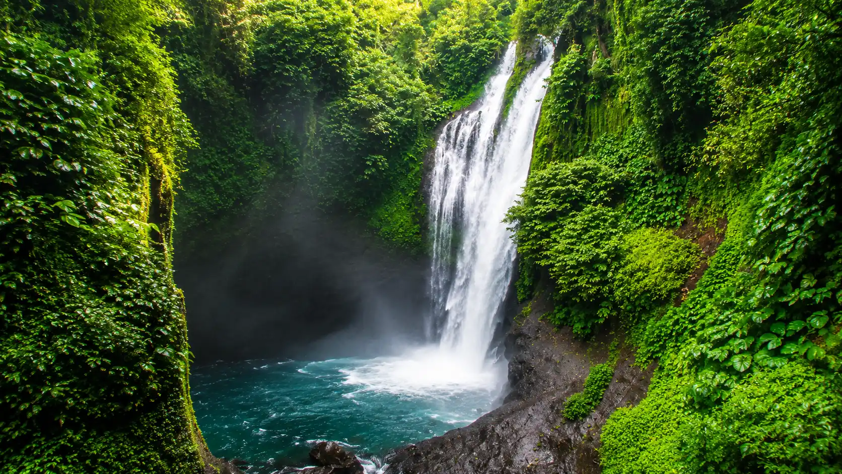 Aling-Aling Waterfall in Sambangan Village, Bali, with natural water slides and cliff jumping