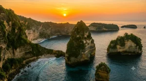 A stunning panoramic view of Diamond Beach featuring towering limestone cliffs, sparkling turquoise waters, pristine white sand, swaying palm trees, and breathtaking tropical island scenery under clear blue skies.