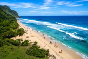Tourists enjoying the pristine white sand and turquoise waters at Nyang Nyang Beach in Bali.