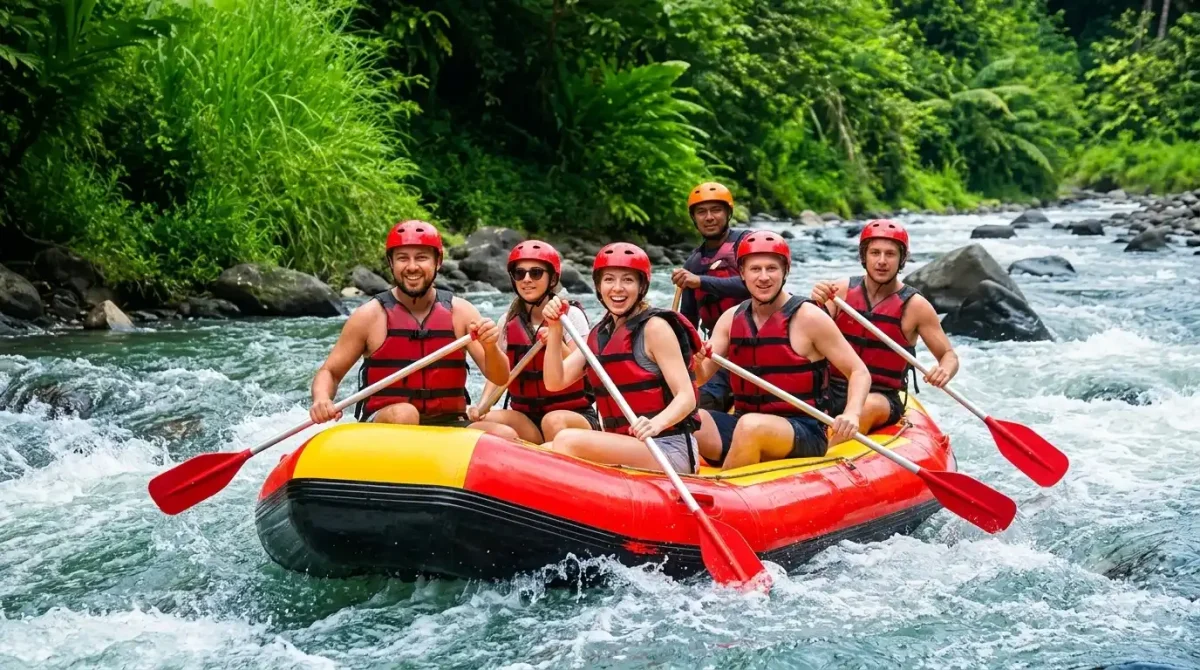 Adventure travelers enjoying white water rafting on Ayung River, navigating exciting rapids through lush tropical jungle, dramatic river cliffs, cascading waterfalls, and breathtaking natural scenery, creating an unforgettable water sports adventure in Bali.
