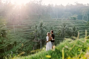 Couple enjoying the scenic rice terraces at Tegalalang in Ubud, Bali.
