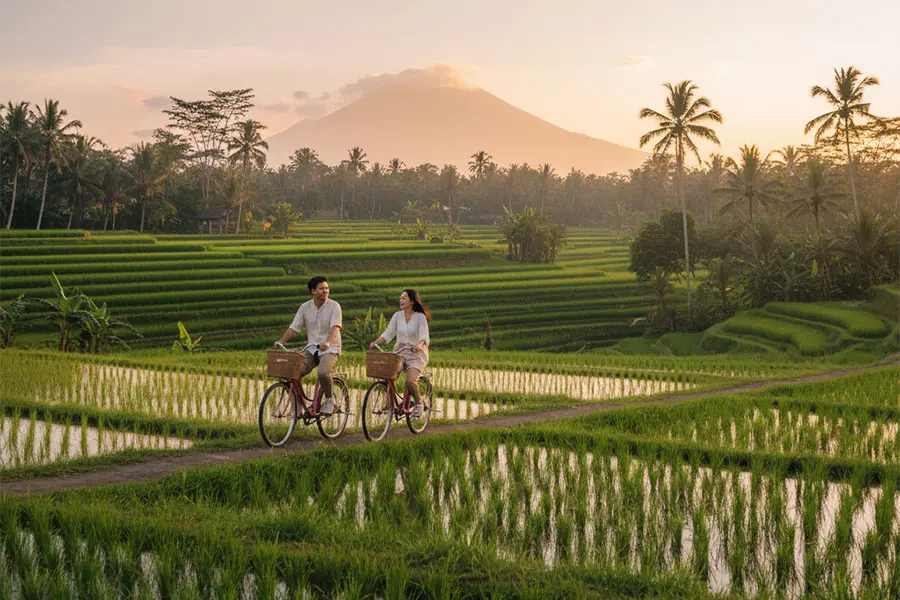 Couple enjoying the scenic beauty of Sidemen Rice Terrace, one of Bali attractions for couples.