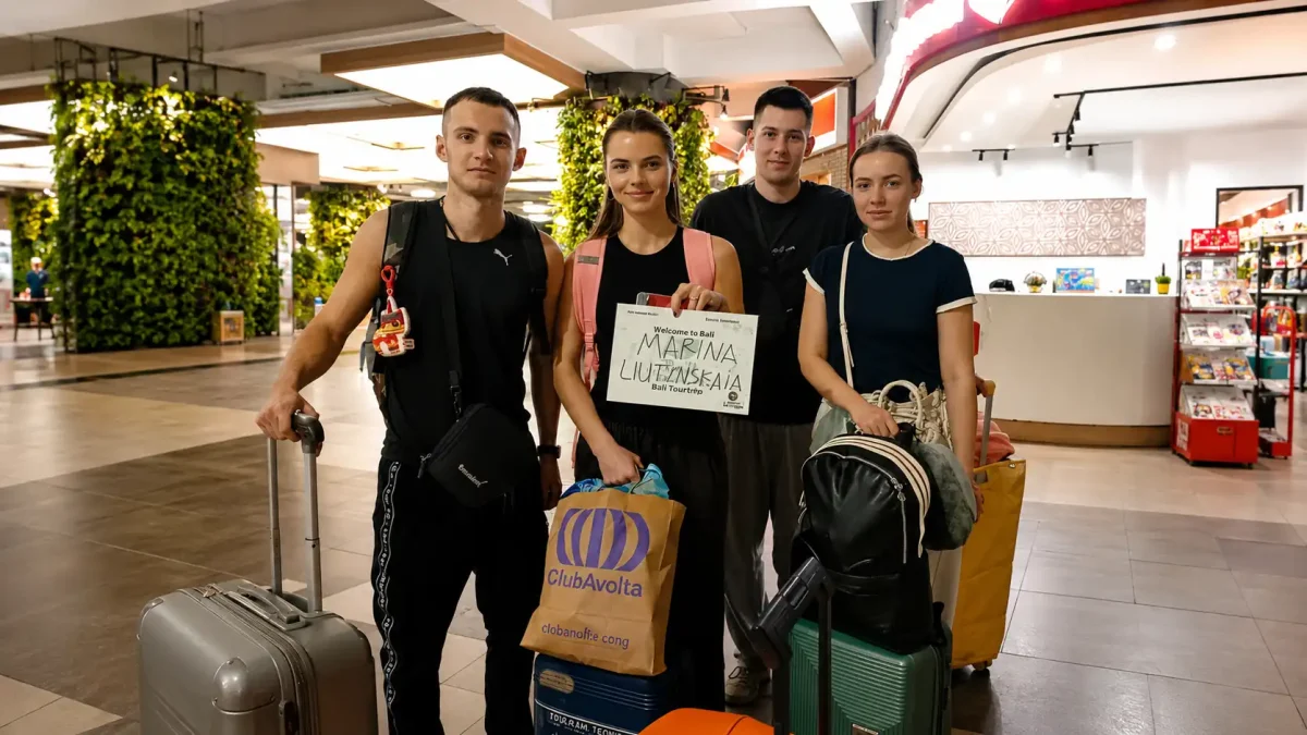 Tourists traveling by private car from Ngurah Rai Airport to Ubud, Bali.