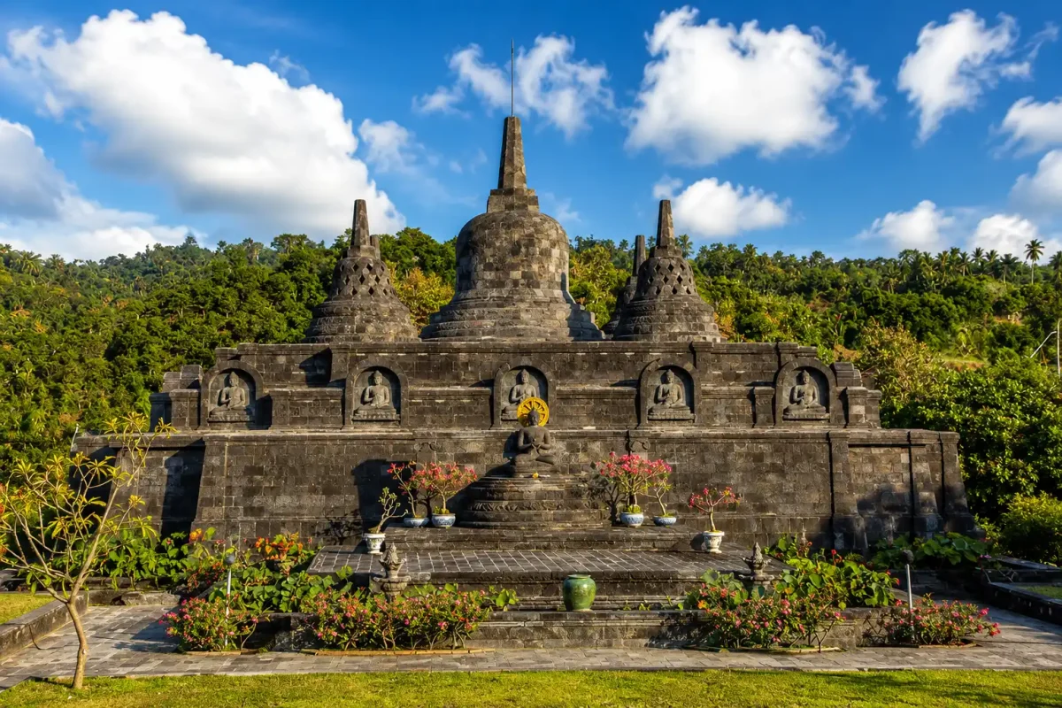 Visitors exploring the peaceful grounds of Brahma Vihara Arama Buddhist monastery in North Bali.