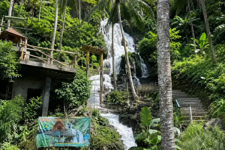 Jembong Waterfall in Ambengan: Natural Pools and Mountain Views