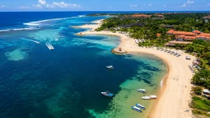 Scenic view of Tanjung Benoa Beach with calm turquoise waters and white sandy shoreline.