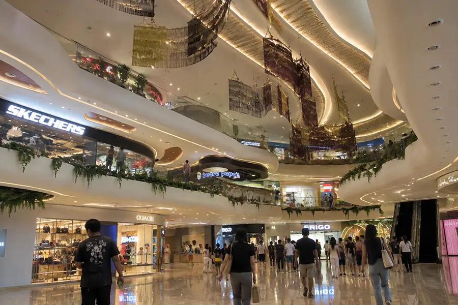 Spacious interior walkways and brand stores inside Icon Bali Mall Sanur.
