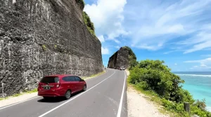 Scenic cliffside road drive from Padang Padang to Uluwatu.