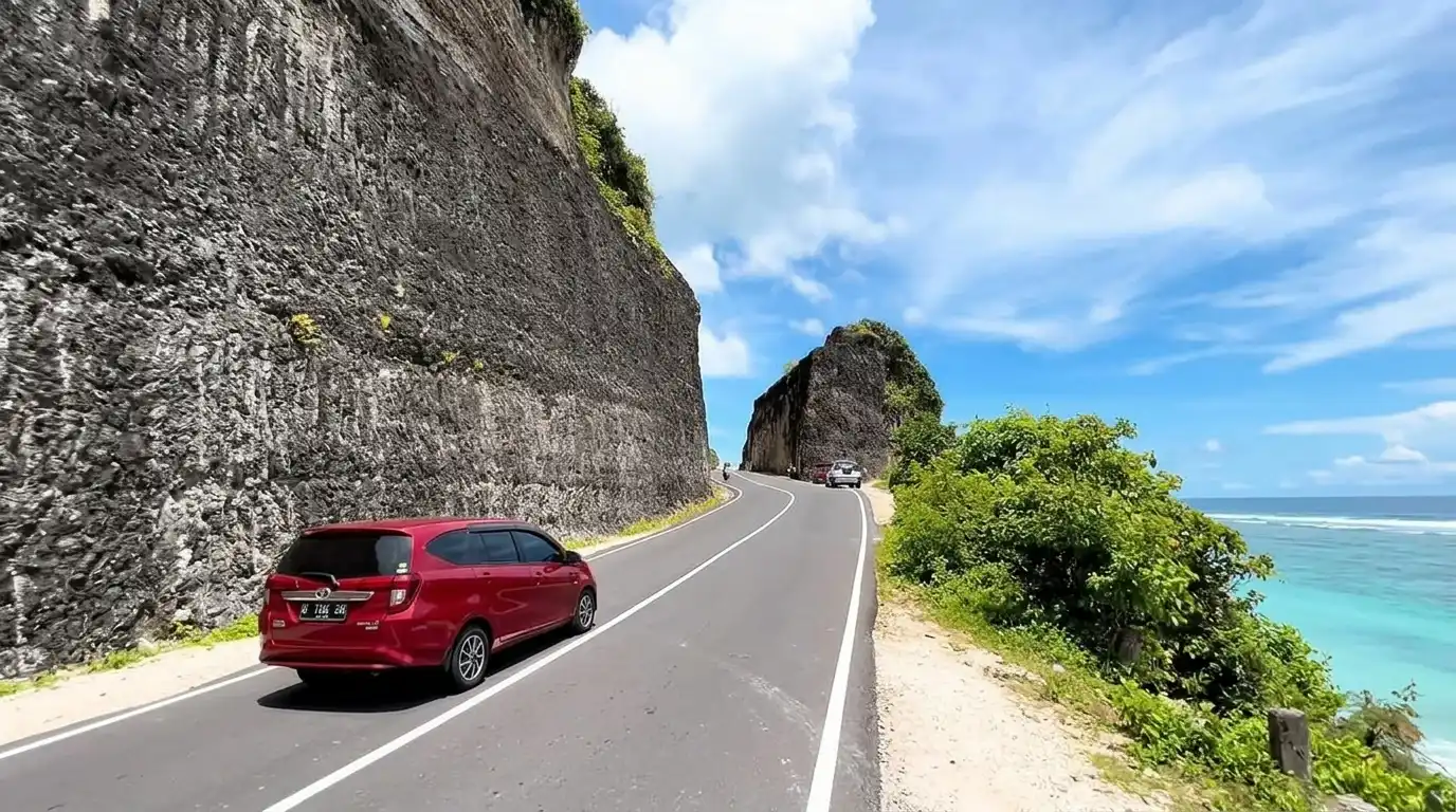 Scenic cliffside road drive from Padang Padang to Uluwatu.