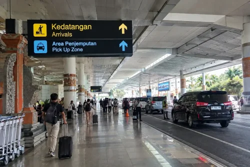 Pick up zone at arrival hall for Bali airport to Sidemen transfer.