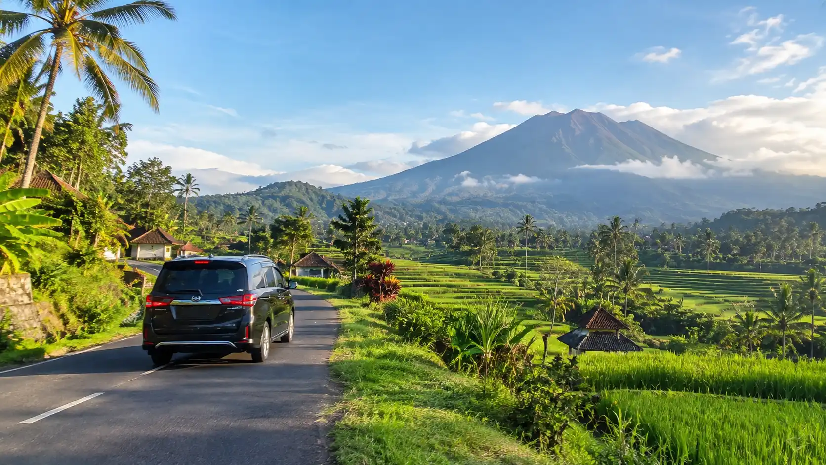 Car driving past Mount Agung on a Bali airport to Sidemen transfer.