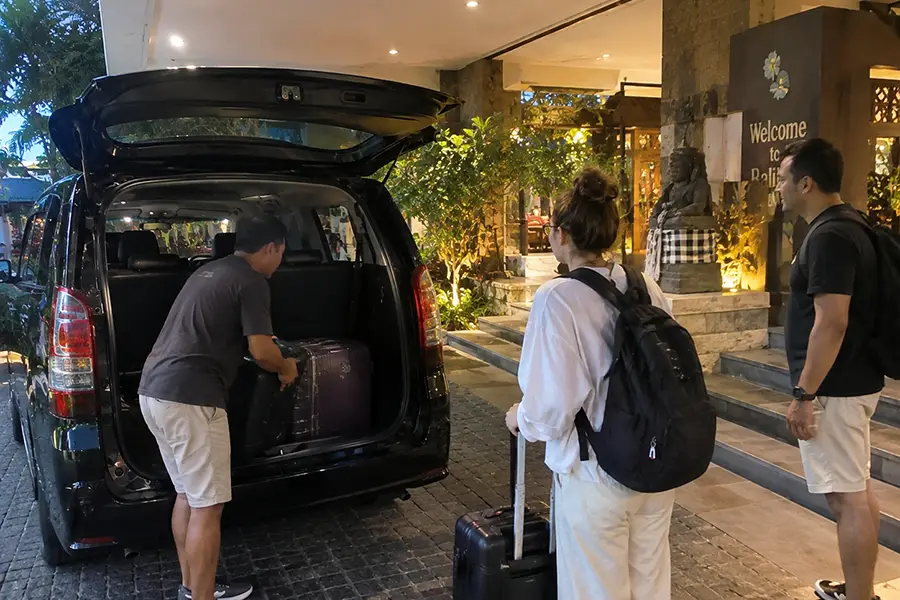Traveller arriving at a Bali hotel after an evening airport transfer