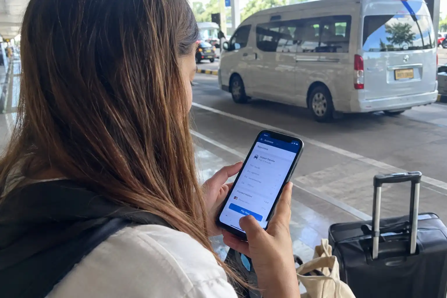 Traveller completing an online Bali airport transfer payment
