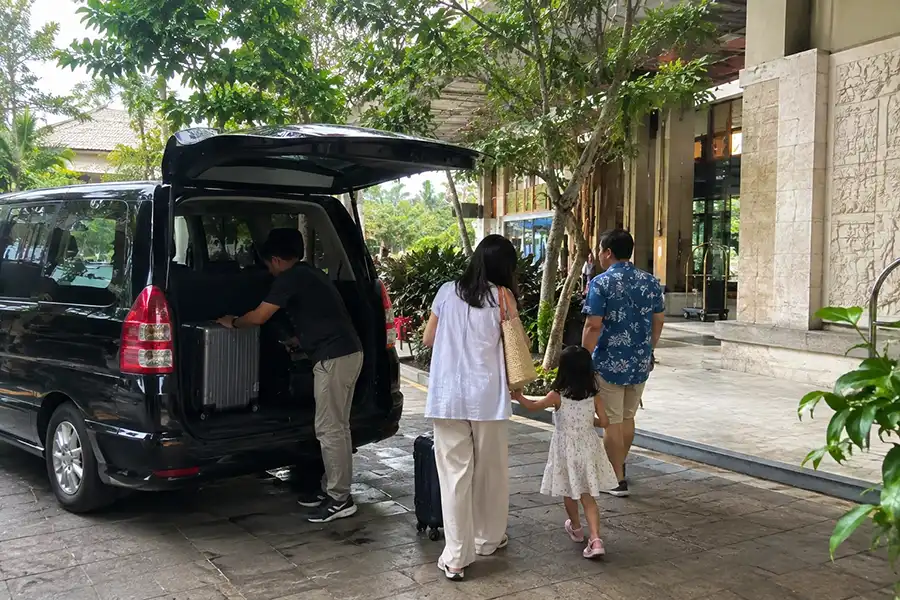 Family airport transfer arriving at Bali accommodation