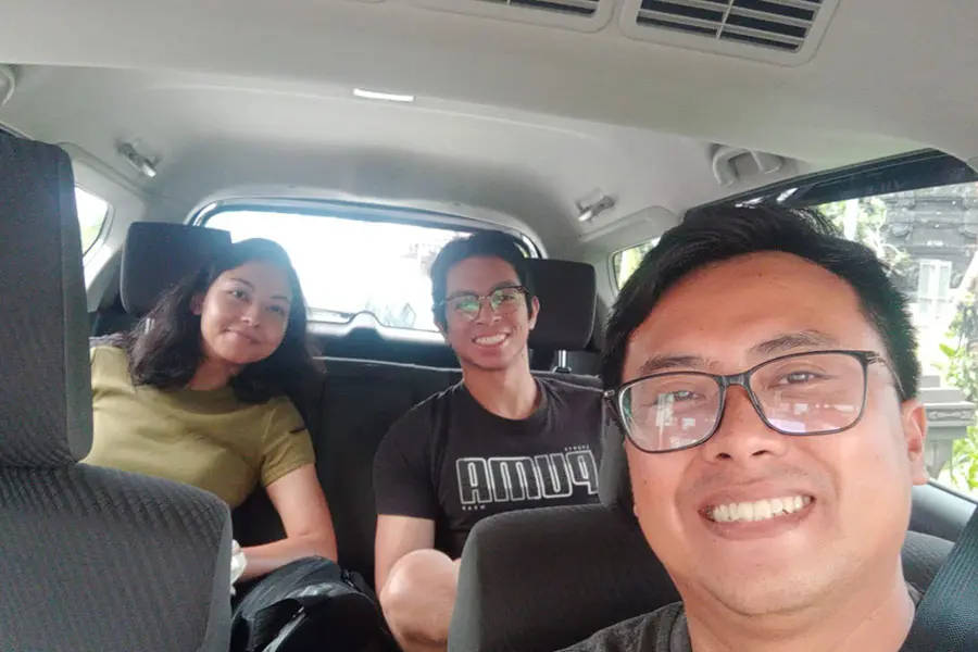 Passengers inside a private car during a Bali car rental with driver